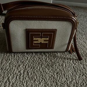 Gorgeous Italian Designer handbag! This bag is an eye catching messenger!